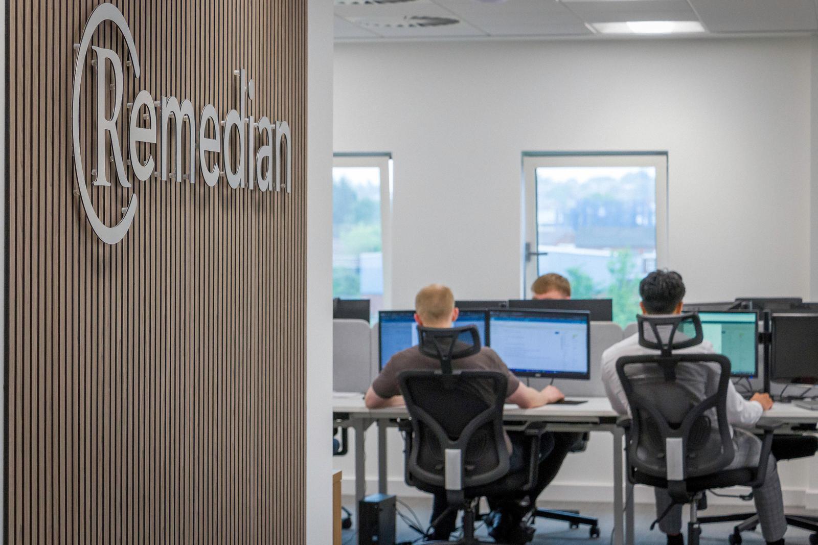 Remedian IT helpdesk staff working from the Manchester HQ, supporting Stockport businesses.