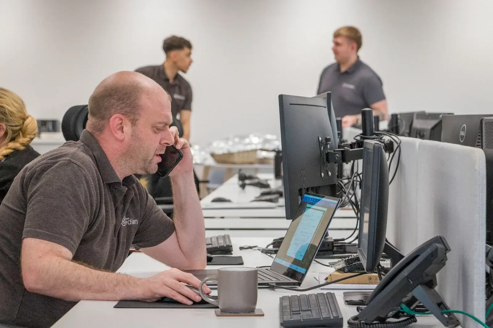 Remedian helpdesk technician providing phone support to a Manchester business