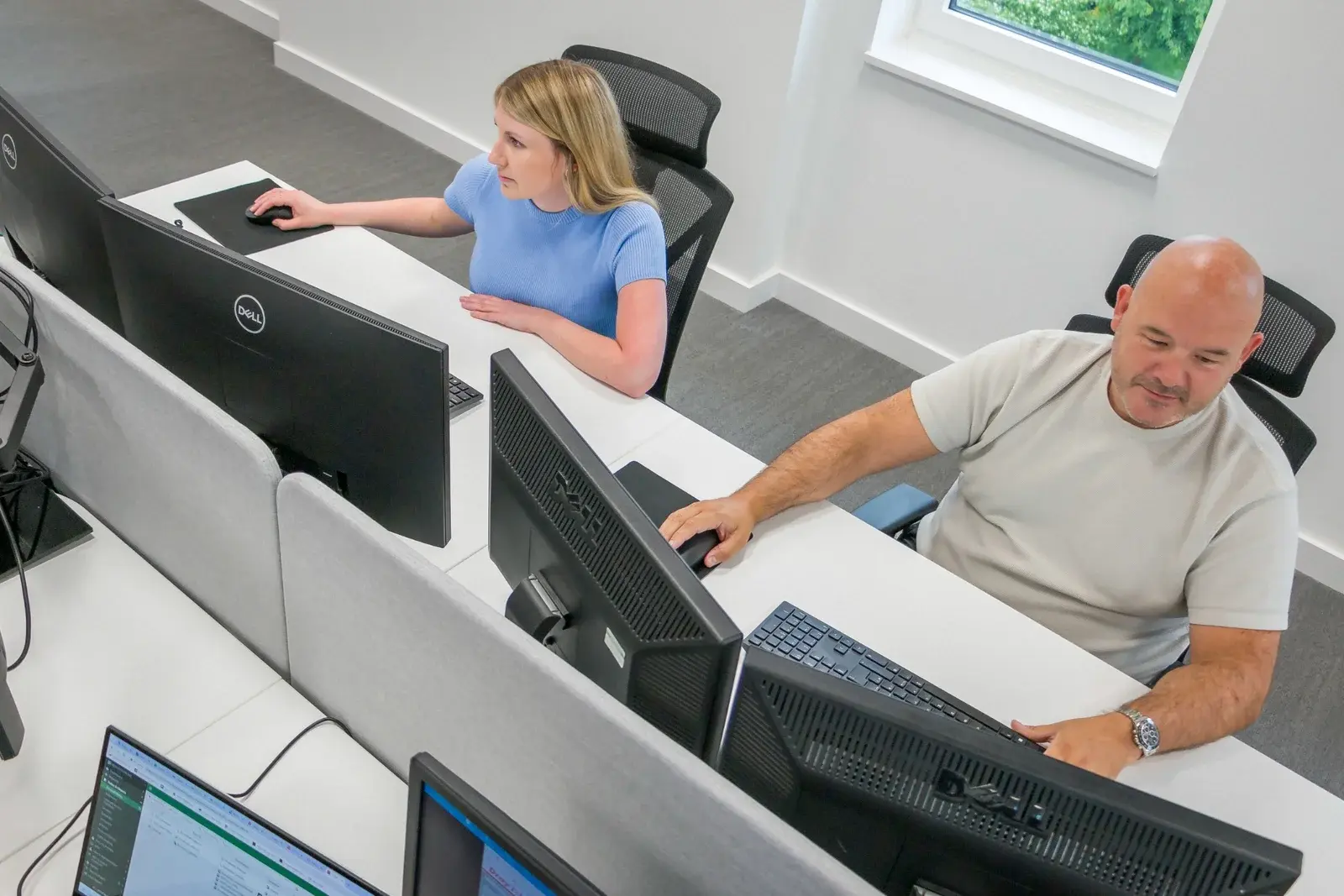 Remedian cyber security specialist providing phone-based IT support in the operations center
